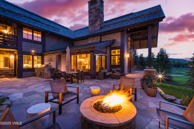 Multi-Sided Flagstone Patio with Panoramic Outdoor Space and a Built-In Gas Fire Pit. | Image 11