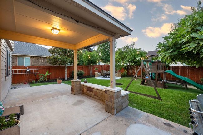 Fenced backyard with a patio and a​​‌​​​​‌​​‌‌​‌‌​​​‌‌​​‌‌​‌​​​​​‌ playground | Image 22