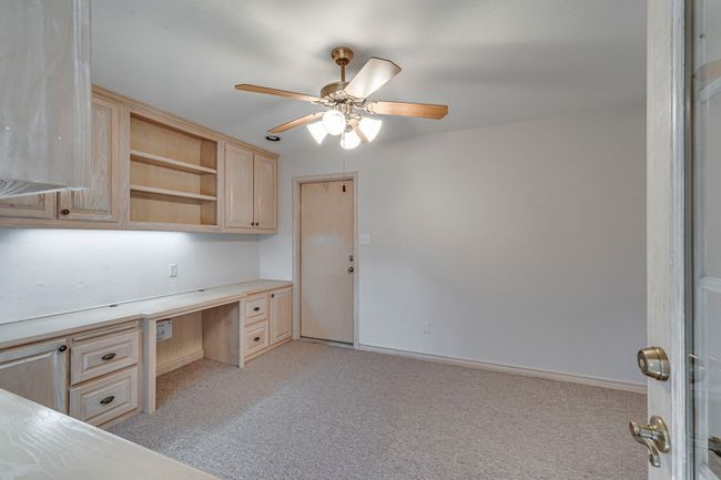Office, complete with built-in shelves, file drawers and two built-in​​‌​​​​‌​​‌‌​‌‌​​​‌‌​​‌‌​‌​​​​​‌ desks. | Image 24