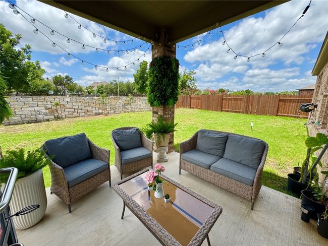 Fenced backyard with outdoor lounge area | Image 31