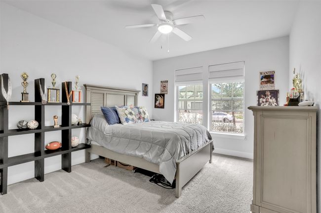 #2 Downstairs Carpeted bedroom featuring ceiling fan | Image 21