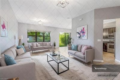 Tiled living room featuring tile walls and a chandelier | Image 2