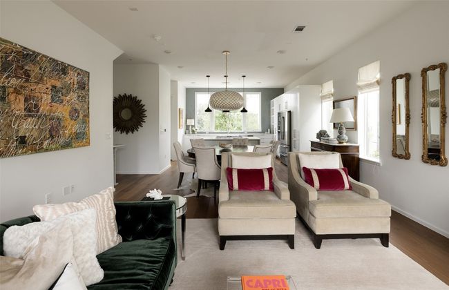 Living area featuring healthy amount of natural light and light wood finished floors | Image 18