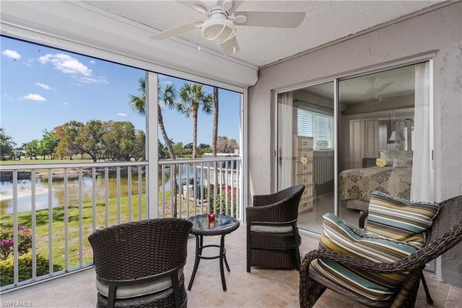 Sunroom featuring a water view and ceiling fan | Image 22