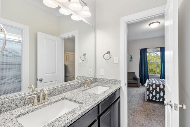 Connected directly to the Jack & Jill bathroom, this bedroom offers comfort, convenience, and a touch of privacy—perfect for kids or guests. | Image 38