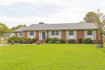 Ranch-style house with a front lawn | Image 1