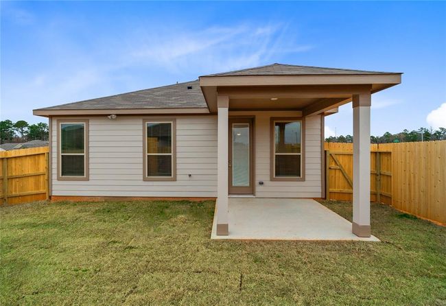 Come and see this spacious backyard with covered rear patio! There is plenty of room for the kids to play and adults to relax! | Image 13