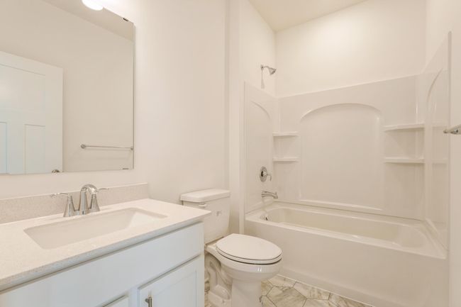 (*Photo of similar home, actual homes colors and finishes will vary) The large secondary bathroom provides plenty of space for everyone to get ready in the morning | Image 22