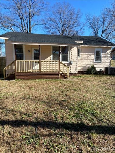 Rear of home with back porch. | Image 2