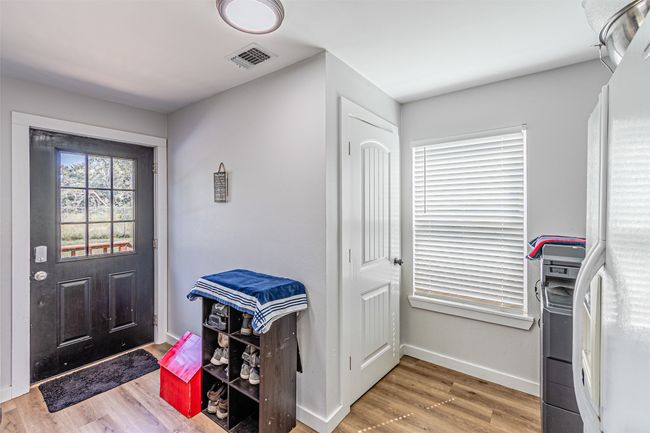 Entryway with wood finished floors and baseboards | Image 16