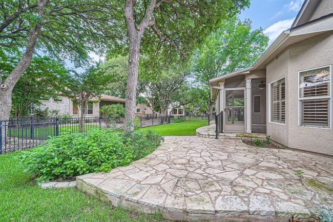 View of patio with a sunroom and ceiling fan | Image 25
