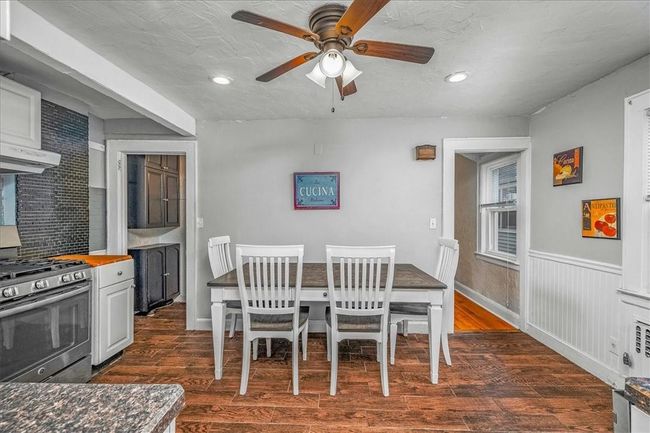 Unit # 70 Dining area with ceiling fan and dark hardwood / wood-style flooring | Image 29