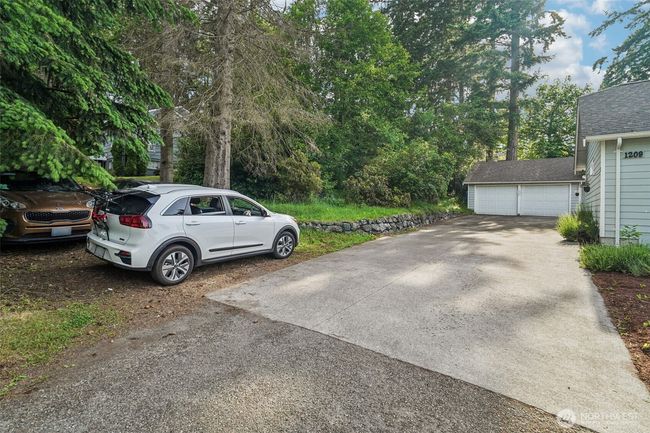 Space for 3 other cars off driveway or turnaround area. | Image 30