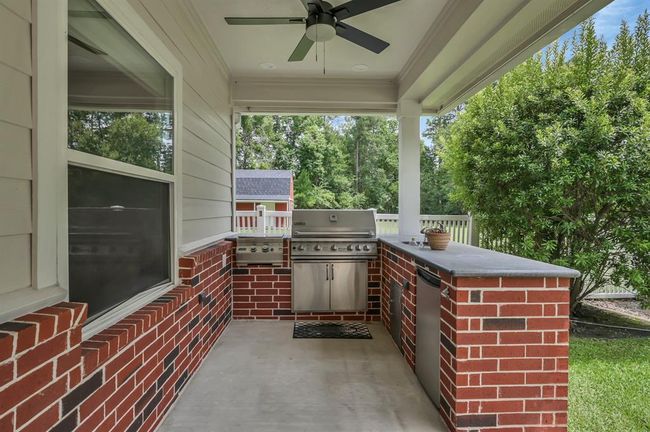 Outdoor Kitchen Built in grill and under counter refrigerator. | Image 42