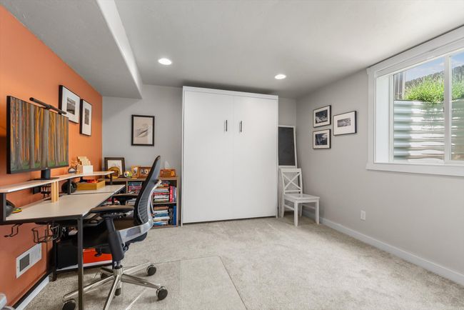 Fully finished basement featuring a Home office/4th bedroom with carpet floors and recessed lighting | Image 29