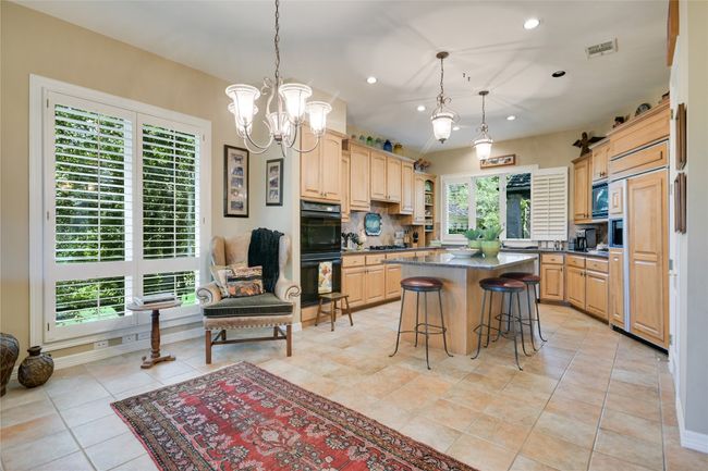 Another dining space between the kitchen and second living room | Image 14