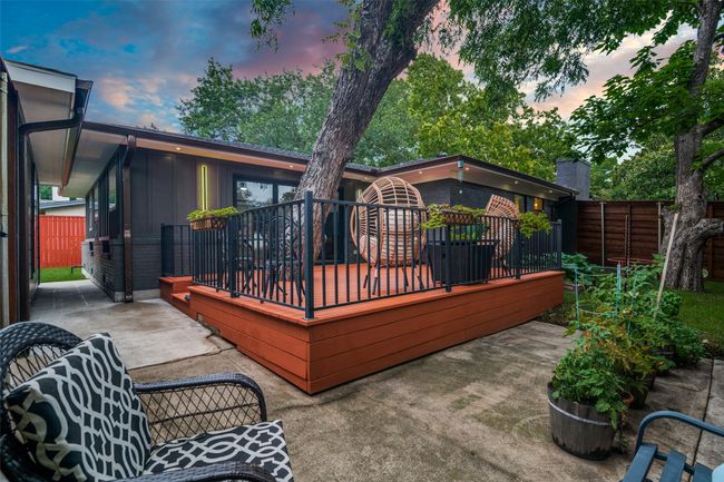 Wooden deck featuring a patio | Image 32