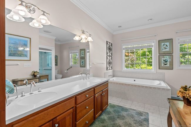Double sinks, lots of light and a deep tub. | Image 12