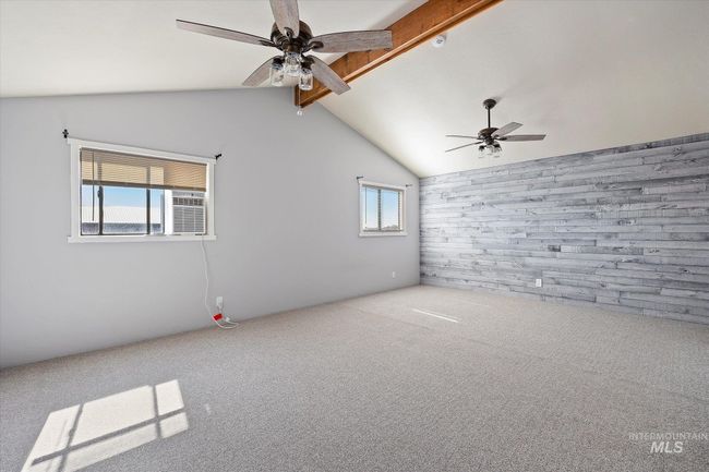 Carpeted empty room with a ceiling fan | Image 17