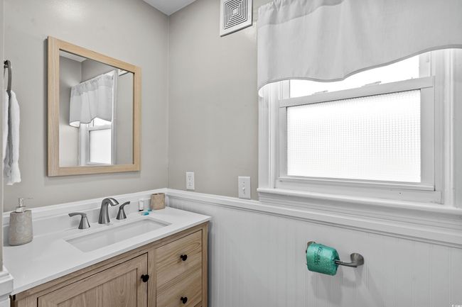 Bathroom with vanity and a wainscoted wall | Image 24