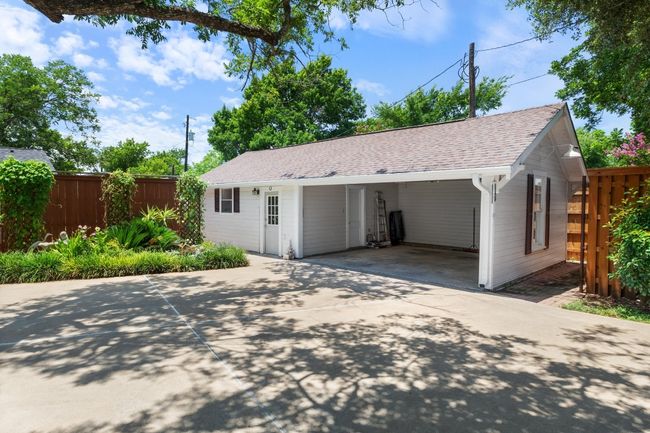 Garage with driveway and an detached carport | Image 26