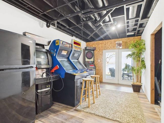 Game room with view to lower patio | Image 64