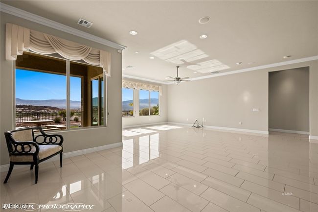 Empty room featuring ornamental molding, baseboards, recessed lighting, and ceiling fan | Image 26