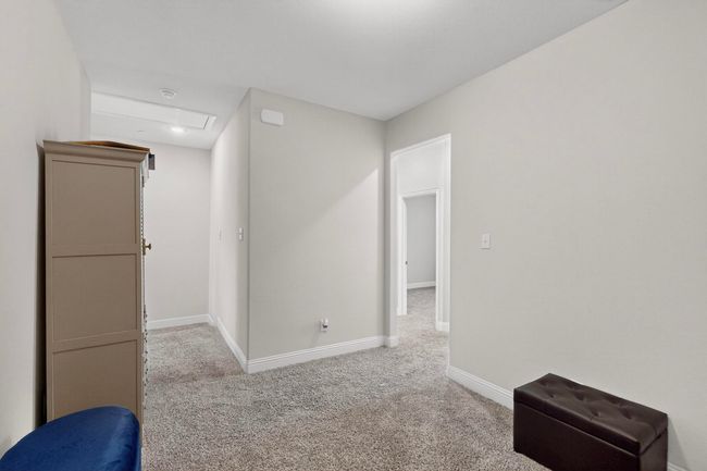 Carpeted empty room featuring baseboards | Image 26