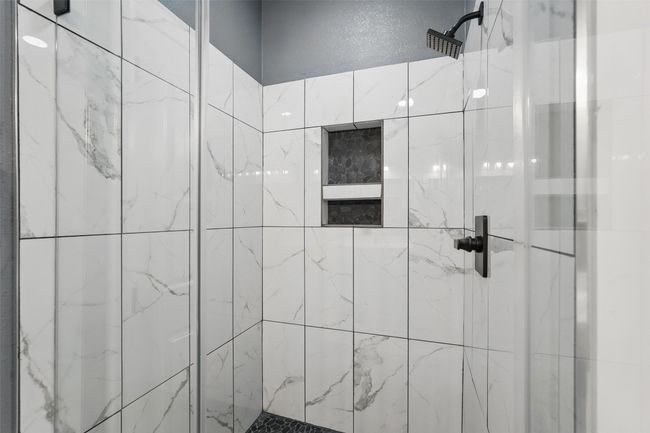 Bathroom with a shower stall | Image 16