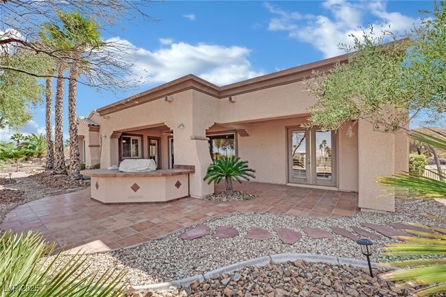 Back of house featuring an outdoor kitchen, french doors, a patio | Image 37