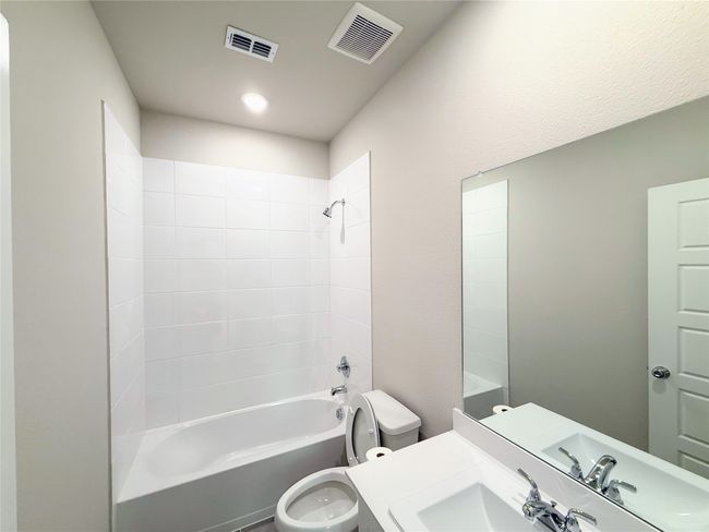 Bathroom featuring shower / washtub combination and vanity | Image 19