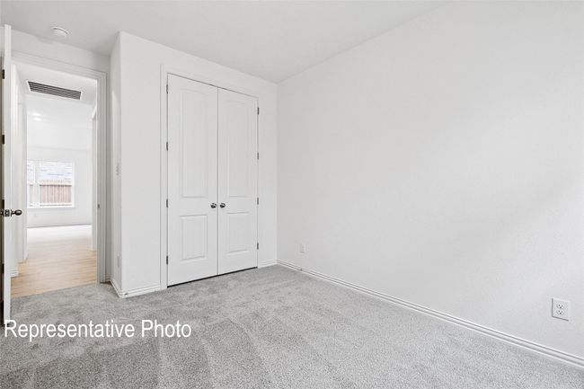 Unfurnished bedroom with baseboards, visible vents, a closet, and carpet flooring | Image 16