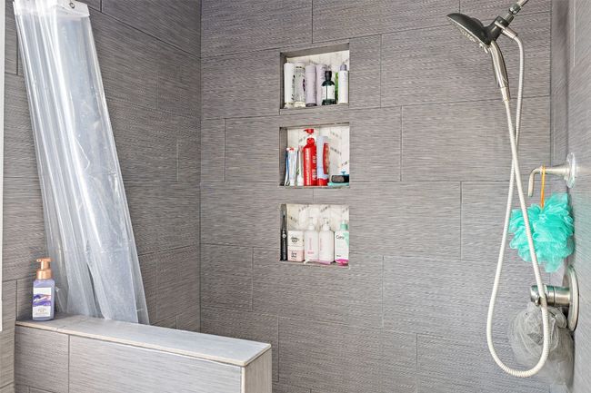 Bathroom featuring a tile shower | Image 24