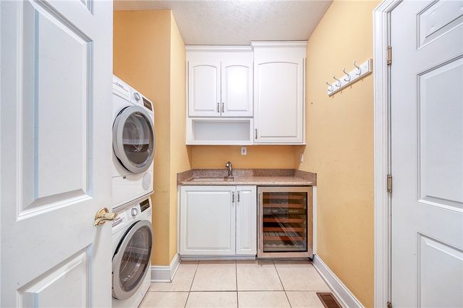 Main floor laundry with included washer and dryer | Image 27