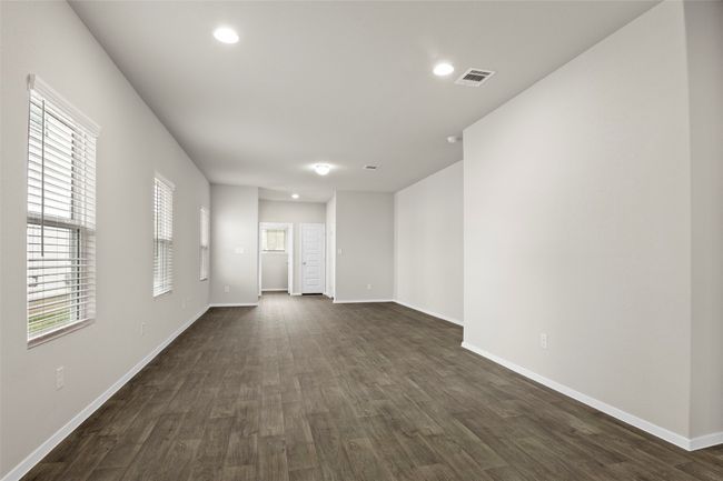 Empty room featuring baseboards, visible vents, recessed lighting, and dark wood-type flooring | Image 11
