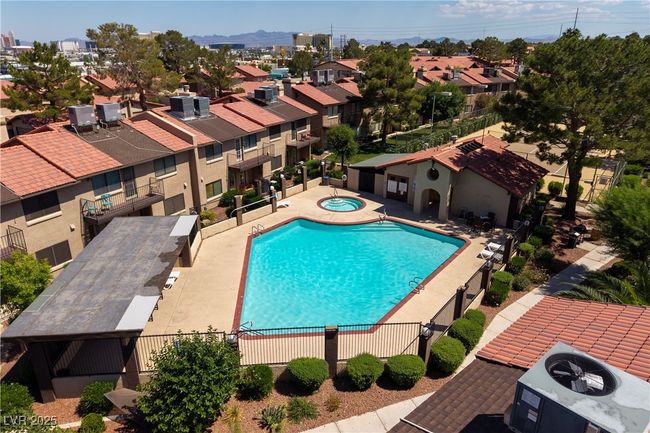 Community pool with a community hot tub and a residential view | Image 32