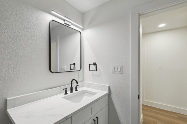 Bathroom with vanity, recessed lighting, and wood finished floors | Image 19