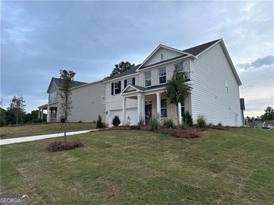 View of front of house featuring a garage and a front lawn | Image 3