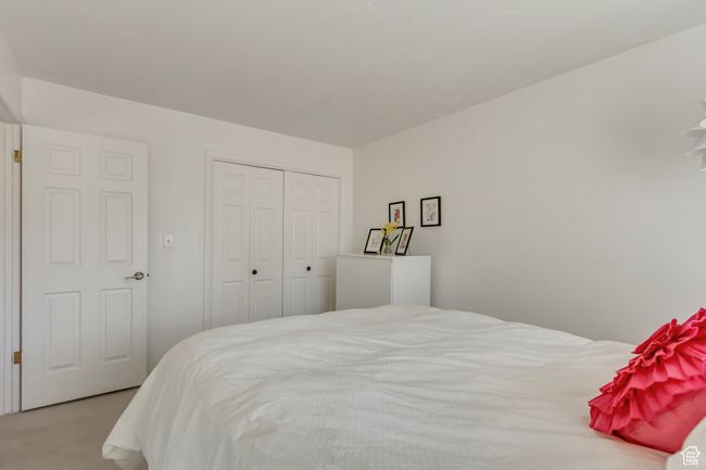 Bedroom with carpet flooring and a closet | Image 21