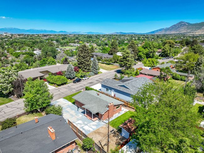 Aerial view of residential area featuring a mountainous background | Image 28