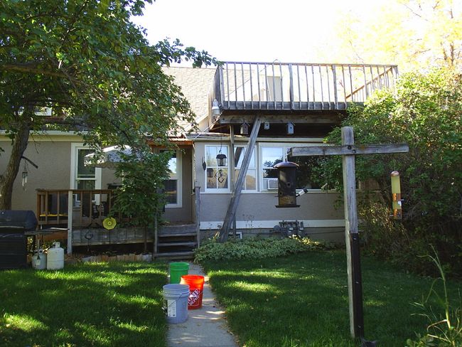Rear view of house with a yard | Image 4