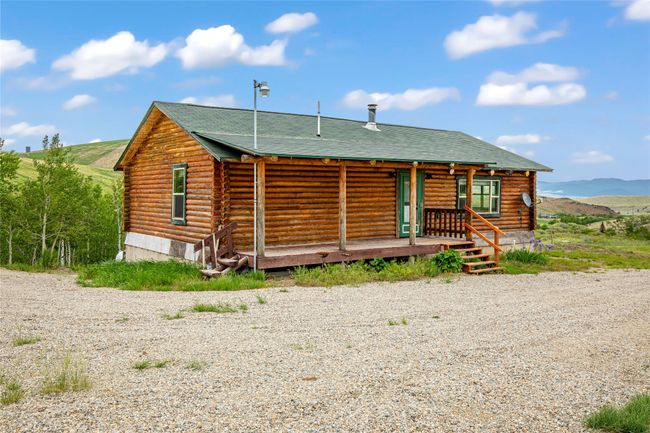 View of front of house with log exterior and a mountain view | Image 27