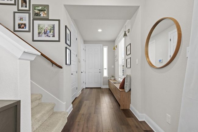 Foyer entrance with dark wood-type flooring, stairs, and recessed lighting | Image 12