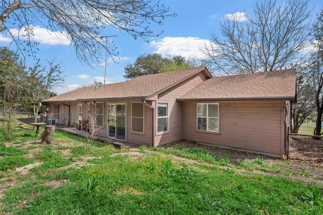 Back of property with fence, roof with shingles, and cooling unit | Image 25