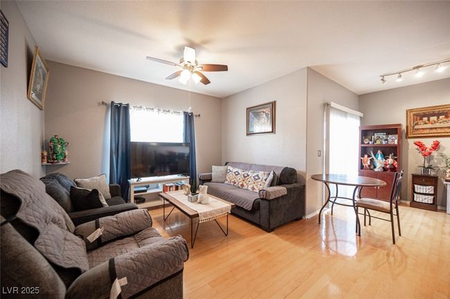 Living area featuring ceiling fan, light wood-type flooring, and baseboards | Image 4