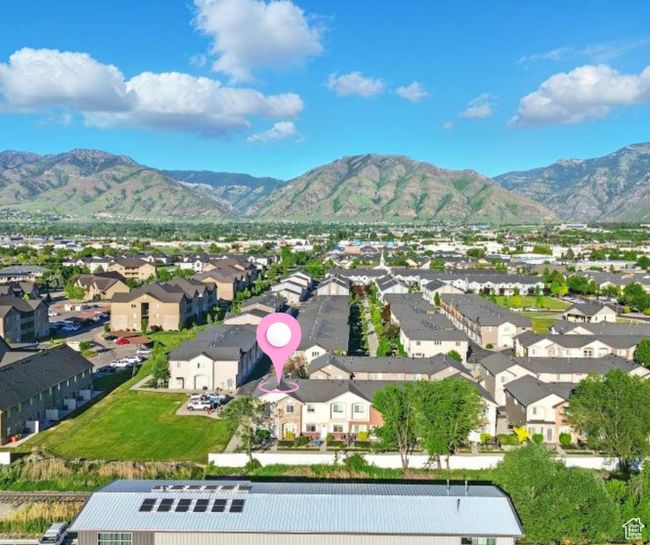 Aerial perspective of suburban area featuring a mountain backdrop | Image 7