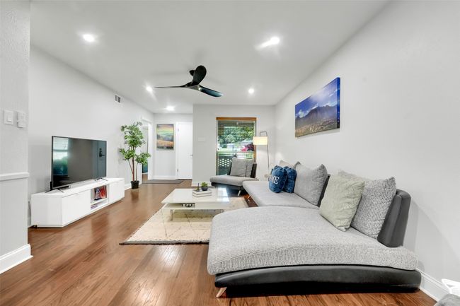 Living room with ceiling fan, wood finished floors, and recessed lighting | Image 23