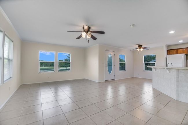 Open concept floor plan has large dining area adjacent to the full-sized open kitchen | Image 10
