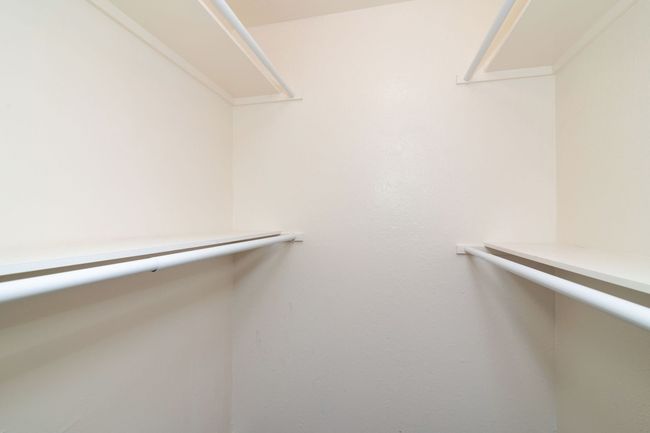 View of spacious closet | Image 11