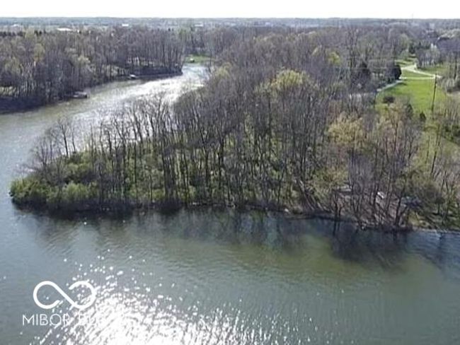 drone / aerial view featuring a water view and a wooded view | Image 6